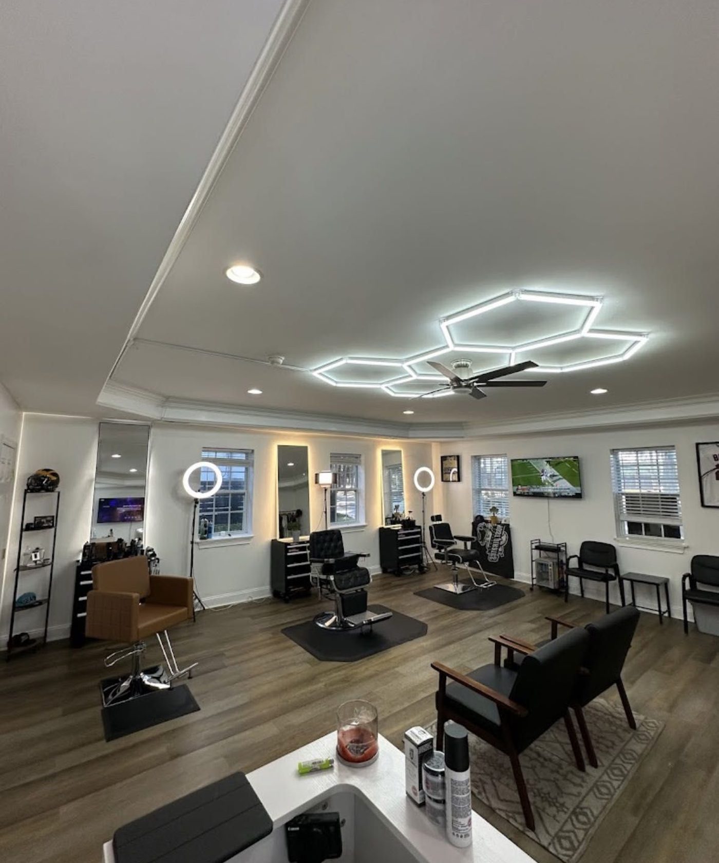 Inside Dutch Cuts — the chairs under the hexagon lights at 2816 Bee Rd