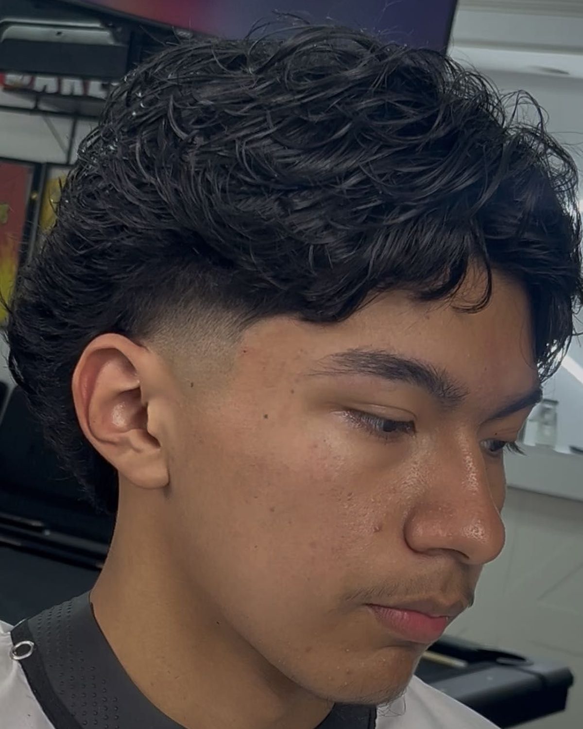 Mid fade on curly hair by Rod